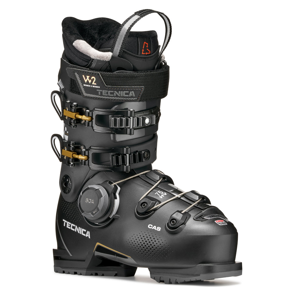 MACHBOAHV75-Black Tecnica ski boot with gold accents on a white background
