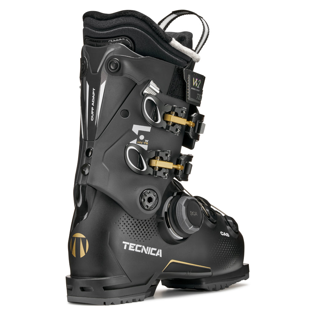 MACHBOAHV75-Black Tecnica ski boot with gold accents on a white background