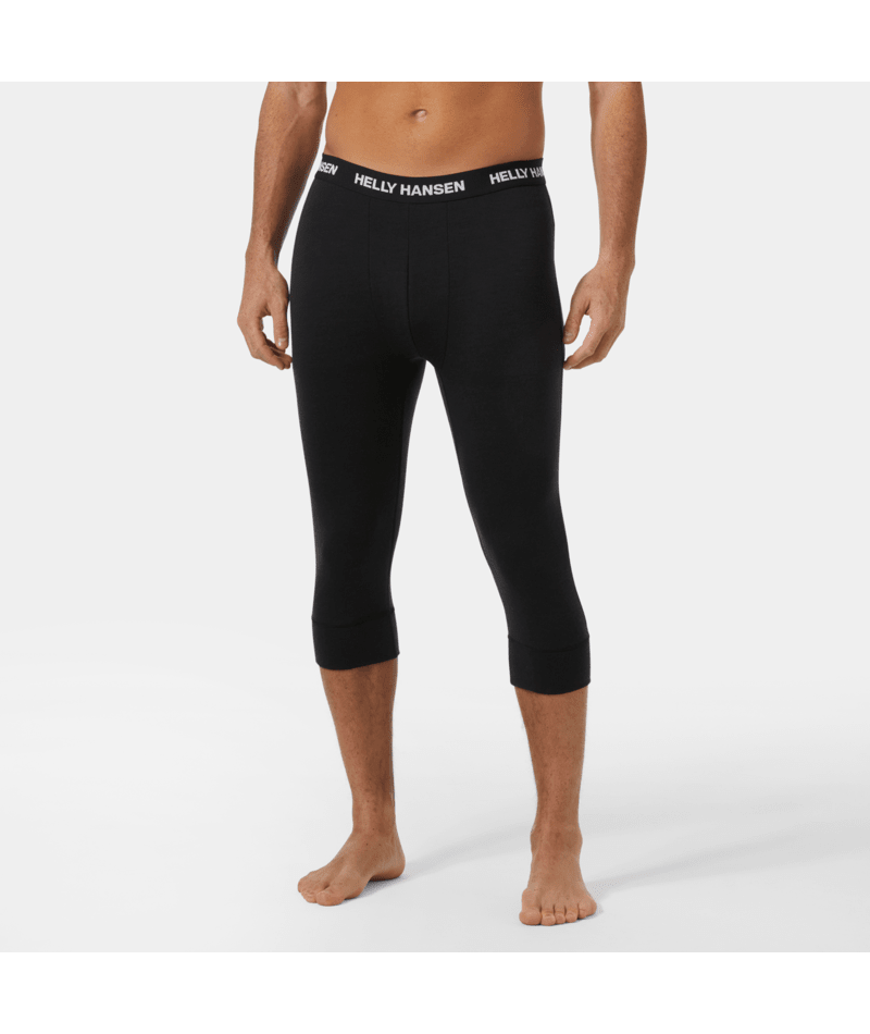 Lifa Merino MW 3/4 Pant-Person wearing black Helly Hansen capri leggings on a white background