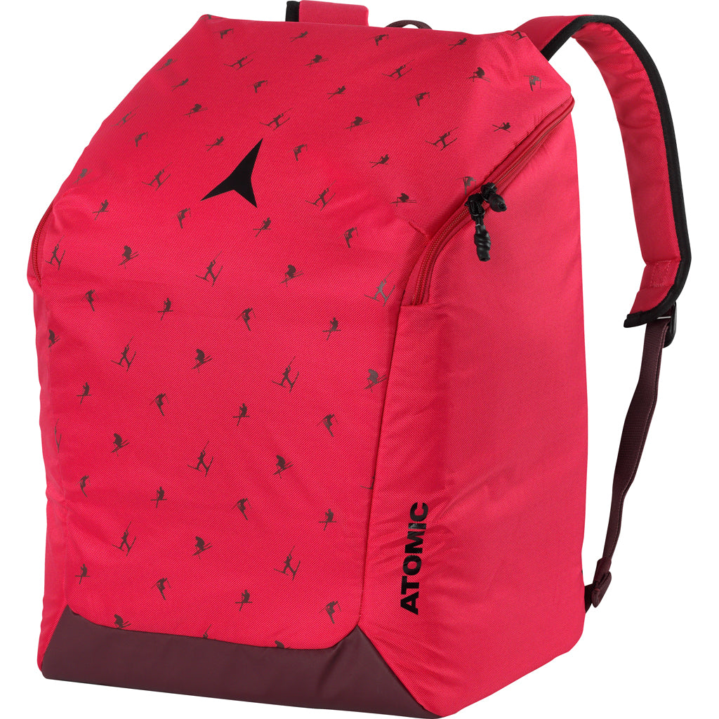 Boot & Helmet Pack-A pink/black Atomic Boot & Helmet Pack designed for adults, featuring a main compartment, padded back panel, and straps.