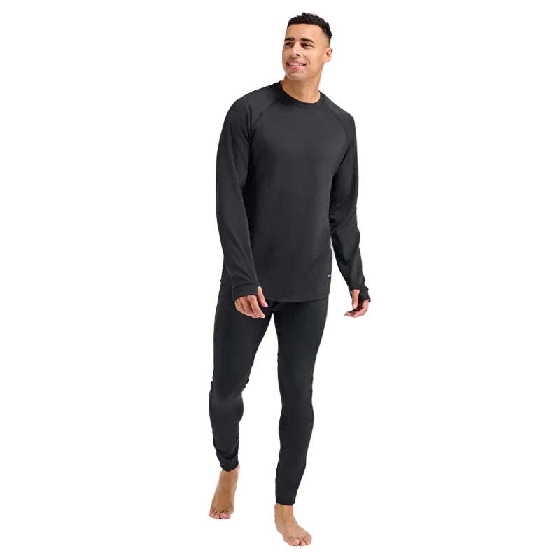 MSummitBaseLayerCrewneck-Man wearing a black long-sleeve shirt and pants on a light gray background