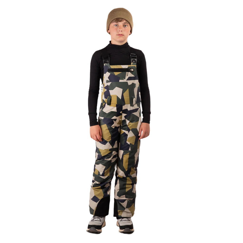 CooperBib-Child wearing camouflage bib overalls on a white background