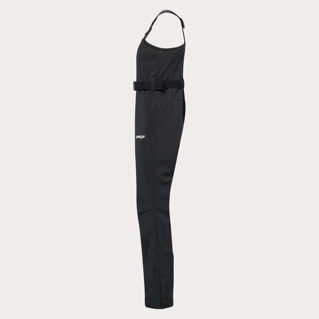WTNPHarperSoftshellBib-Black ski jumpsuit with a belt on a light gray background