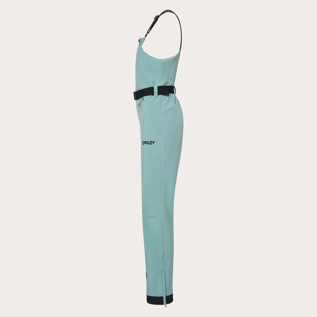 WTNPHarperSoftshellBib-Teal ski jumpsuit with a belt on a light gray background