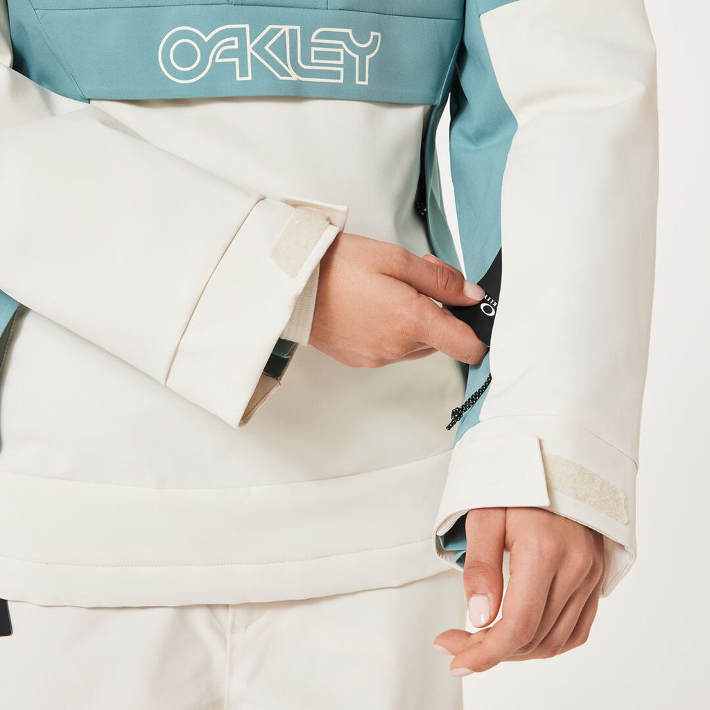 TNP TBT Insulated Anorak-Green and white jacket with Oakley logo on a light gray background