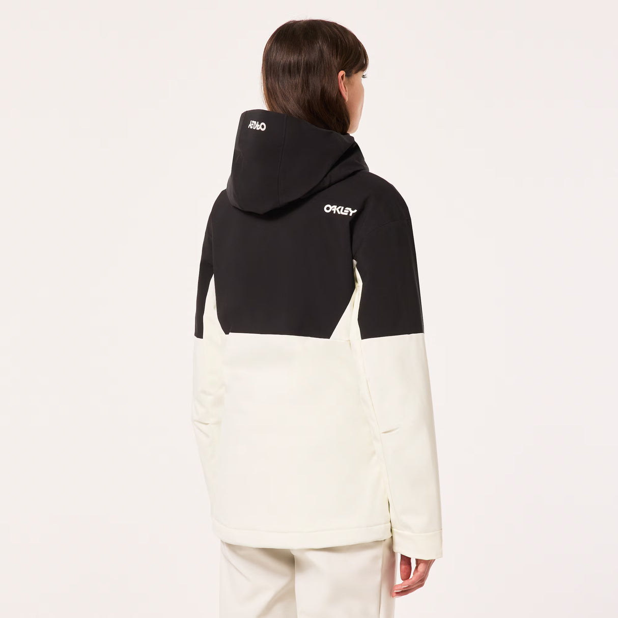 TNP TBT Insulated Anorak-Black and white jacket with Oakley logo on a light gray background