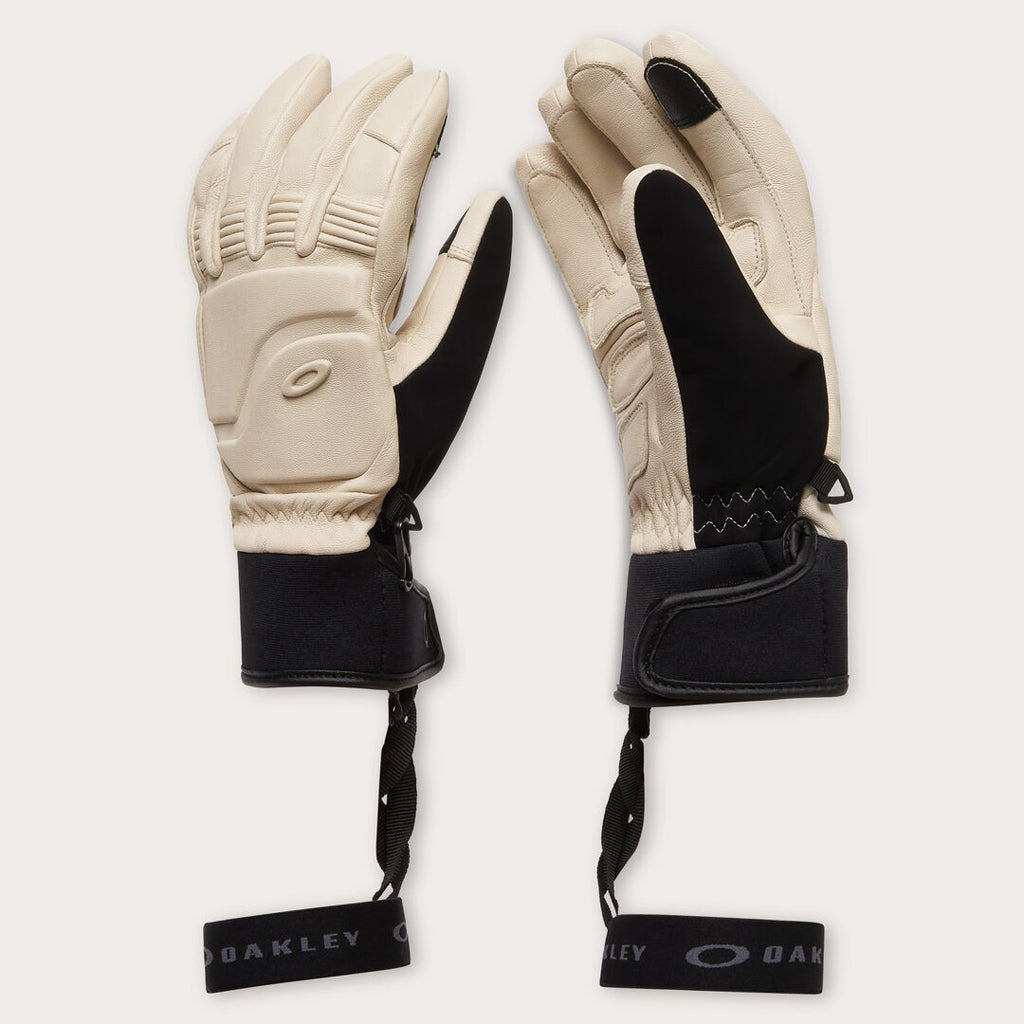 Peak Leather Glove-Pair of beige and black gloves with Oakley branding on a white background