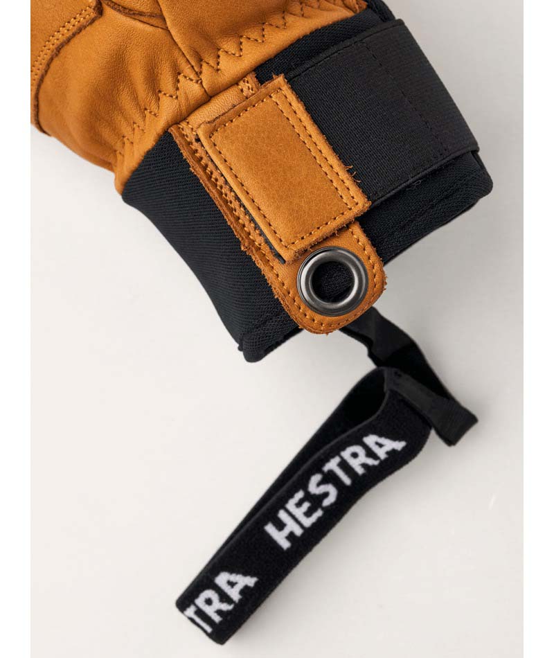 FallLine-Pair of brown leather gloves with black cuffs on a white background