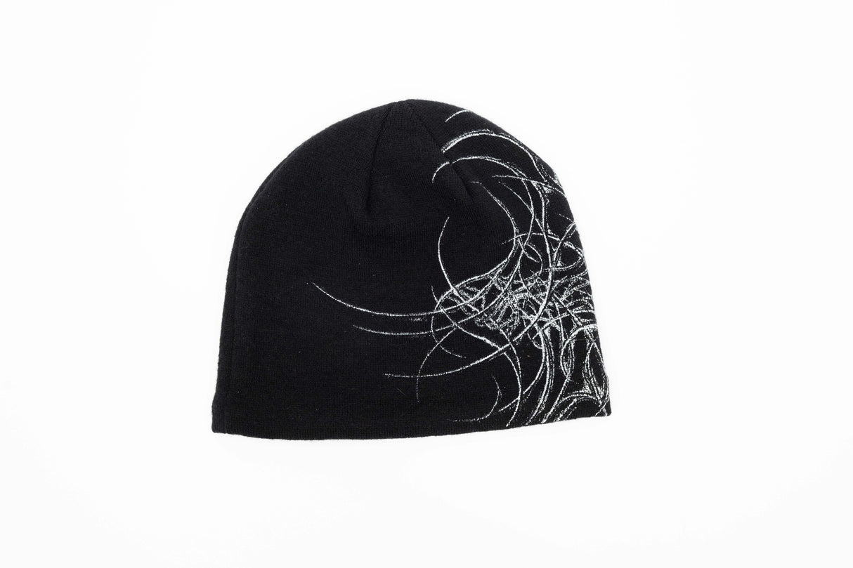 GeneralSkully- A black knit beanie hat featuring a white abstract line-art graphic on the left side and a small yellow 'public' logo on the lower right edge, shown against a plain white background.