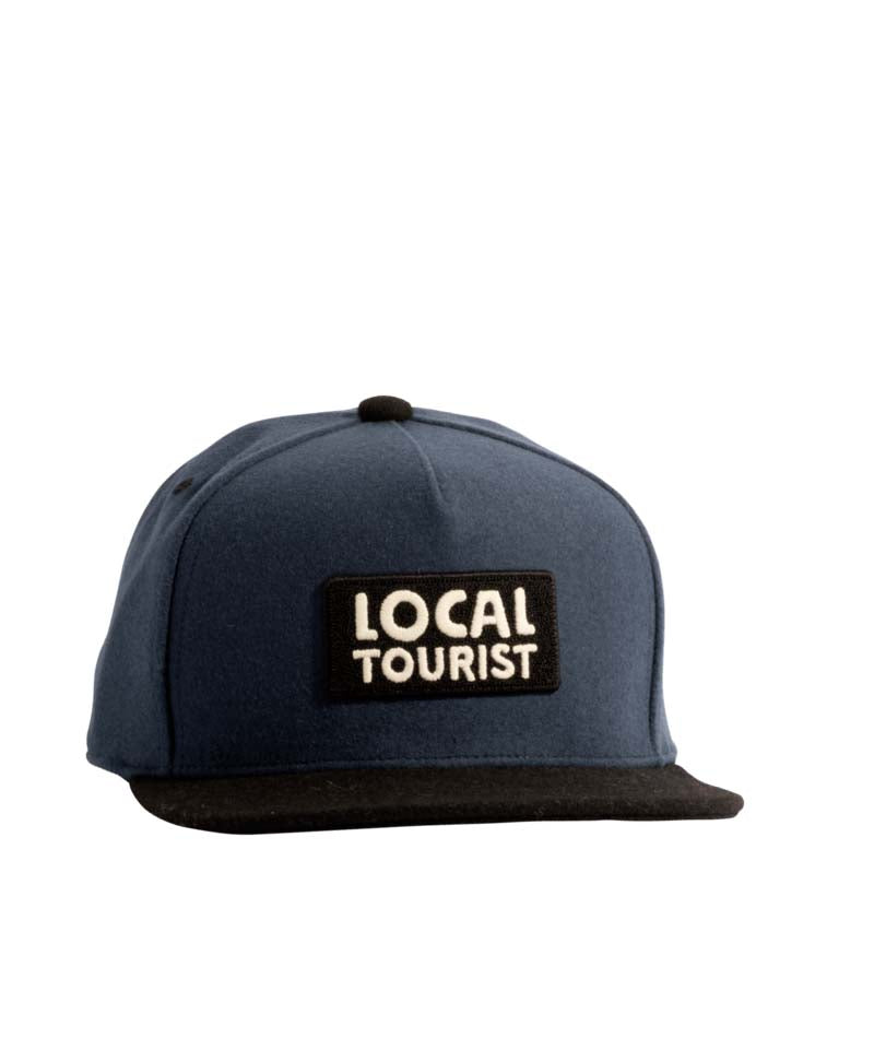 HaulerWool-Blue and black cap with 'LOCAL TOURIST' logo on a white background