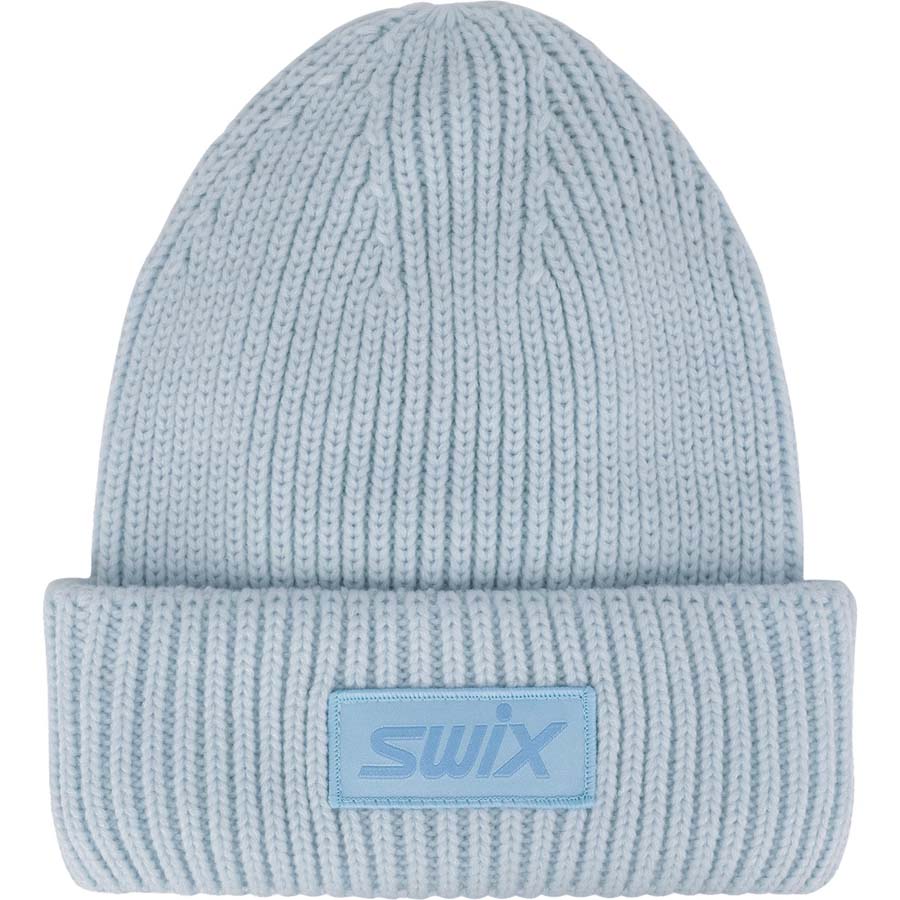 HorizonBeanie-A light blue ribbed knit beanie hat with a folded cuff and a square patch on the front featuring the 'swix' logo.