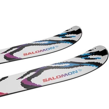 JR.QSTBLANKTEAM-A pair of Salomon skis shown vertically against a plain white background, featuring a white base with a colorful abstract pattern of black, red, purple, and blue.