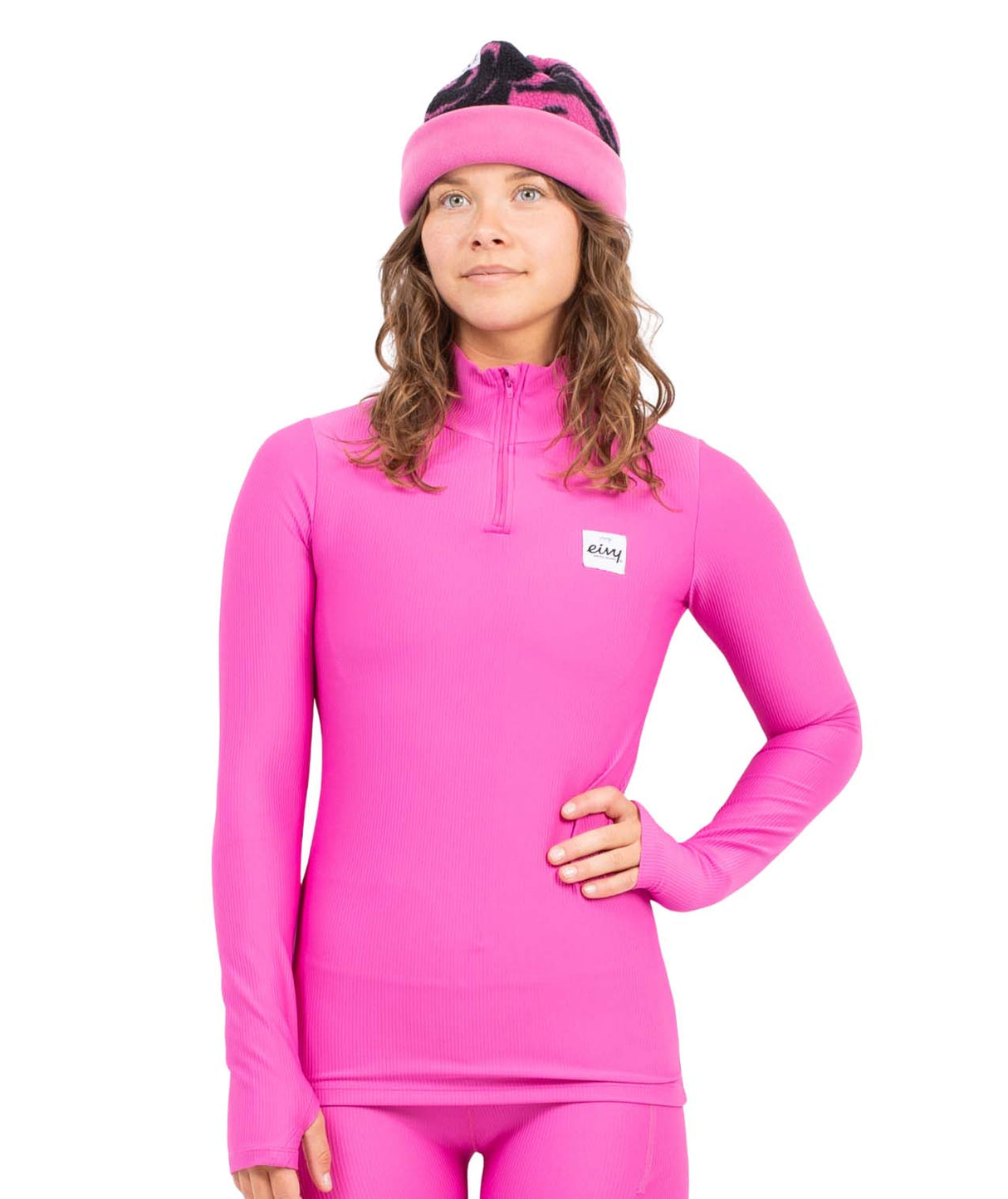 JourneyRibTop- Woman wearing a hot pink quarter zip on a white background