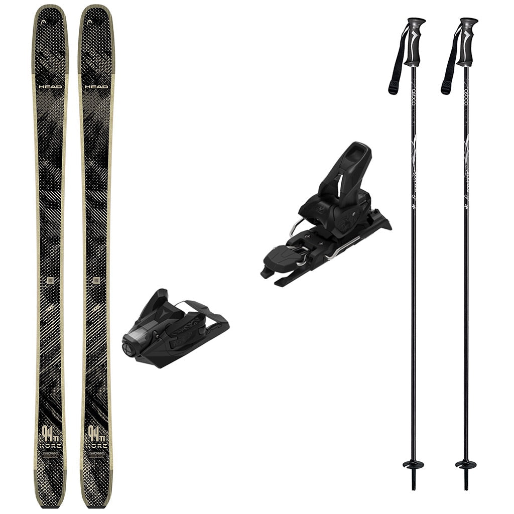 KORE94Tiw_Strive12-A ski gear set on a plain white background, including a pair of black and gray patterned skis, two black ski bindings, and two black ski poles with white graphics.