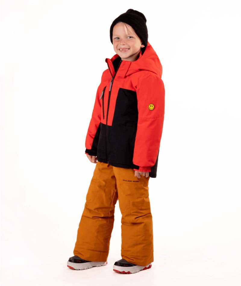 KidsReactorJacket-Child wearing a red and black jacket with orange pants on a white background