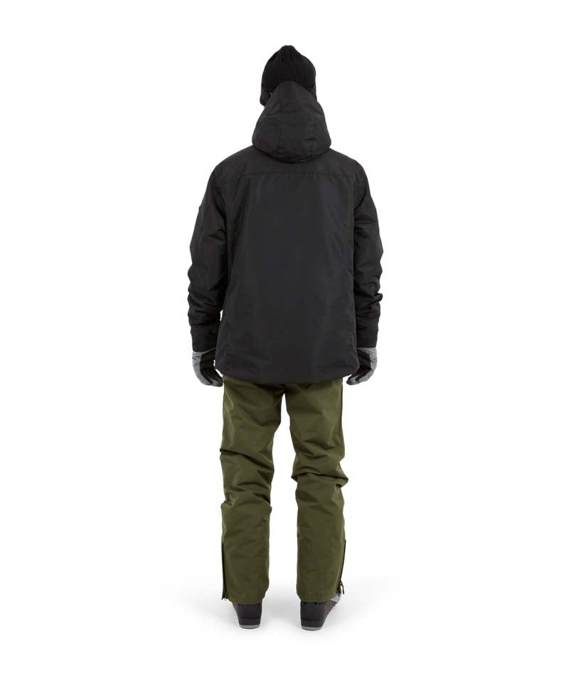 KnoxJacket-A man wearing a black snowboard jacket, black beanie with goggles, and gray gloves, standing against a solid white background.