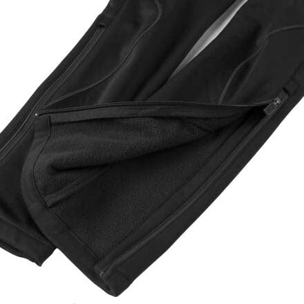 LillehammerKidsPants-Black athletic pants with zippered side pockets and a white SWIX logo on the left thigh, shown against a plain white background.