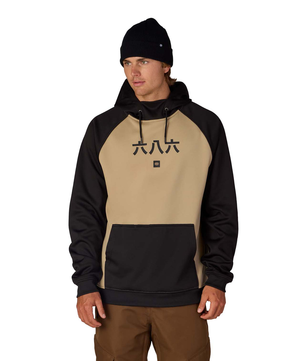 MBondedFleeceHoody-Person wearing a black and beige hoodie with a logo on a white background