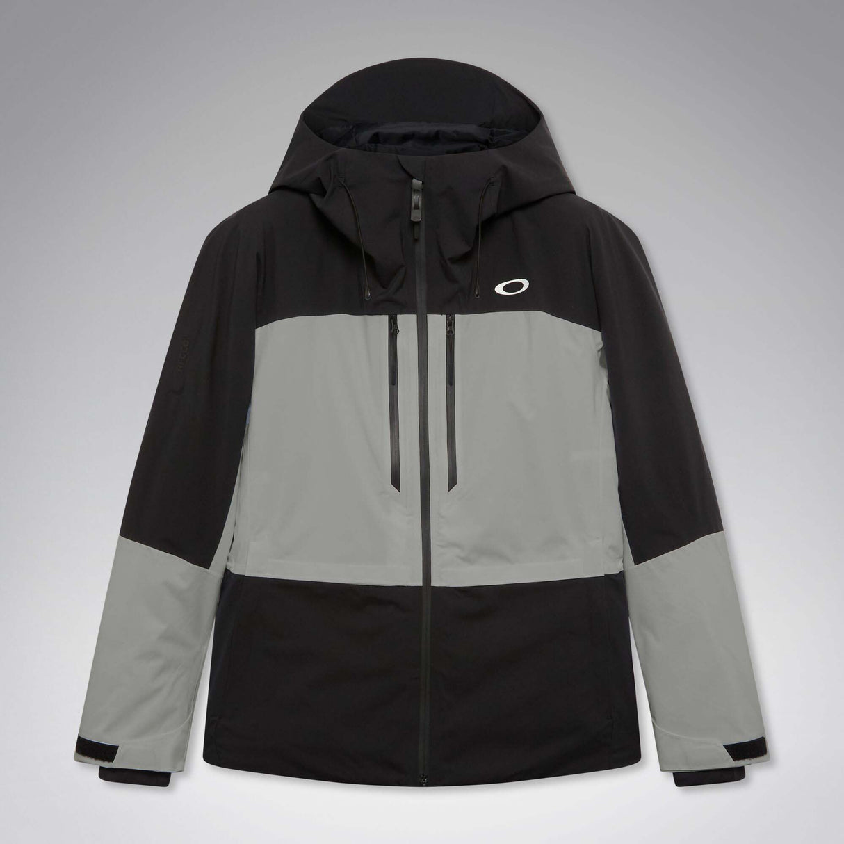 MCanopyProInsulatedJacket-A colorblock hooded jacket with a black upper section and sleeves, a light gray midsection, and a black lower section, featuring a full-zip front and a small white Oakley logo on the chest.