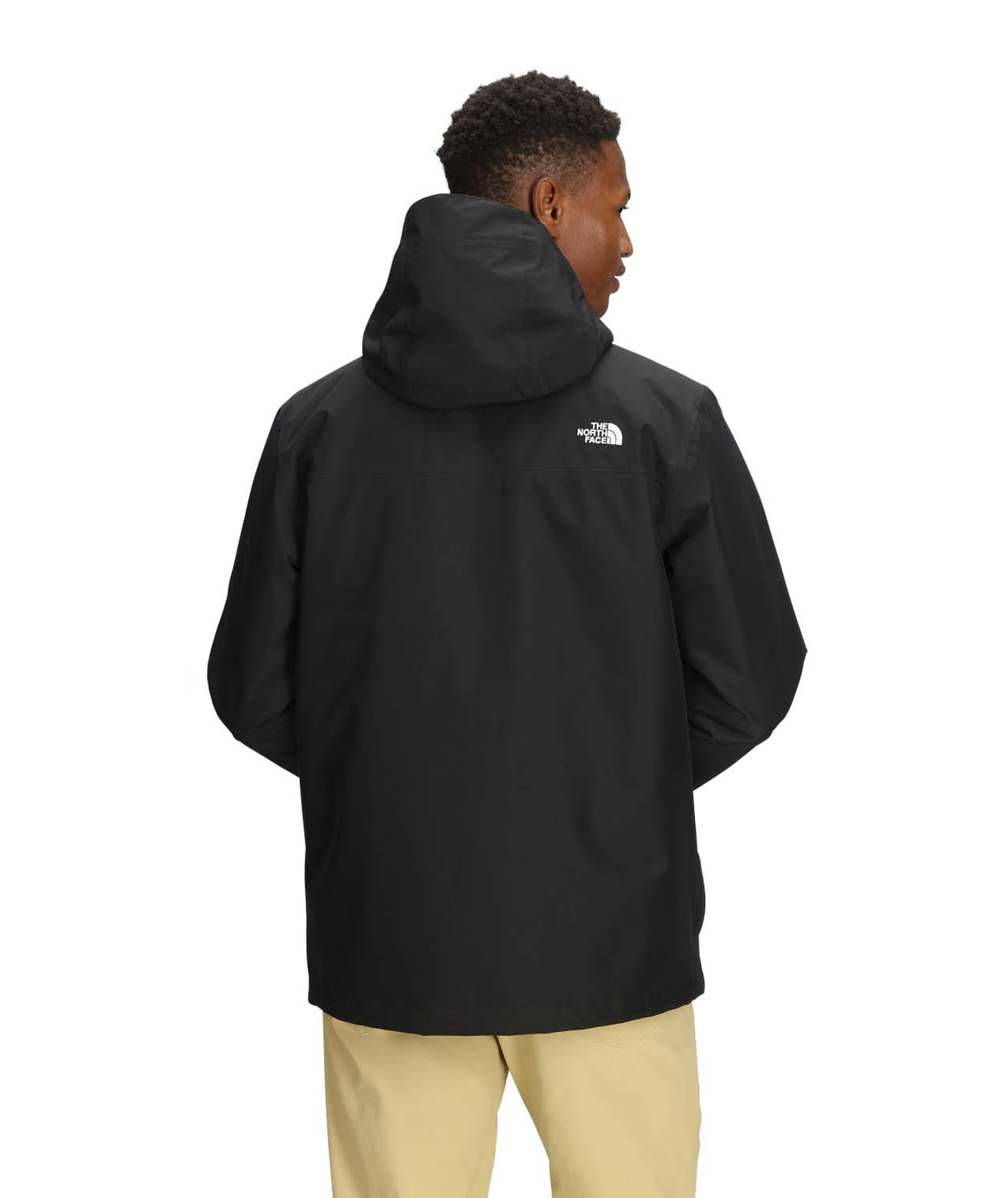 MCartoMonoTriclimateHoodedJacket-Person wearing a black jacket with a brand logo on the back, standing against a white background