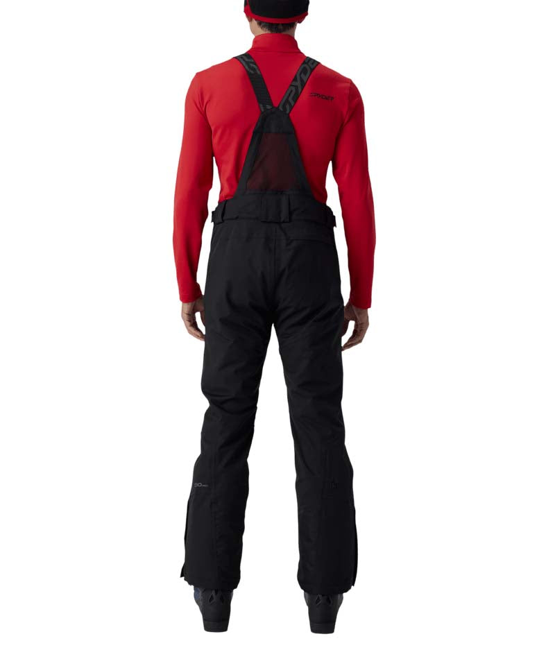 MDarePant- Man wearing black snow pants with overalls on a white background