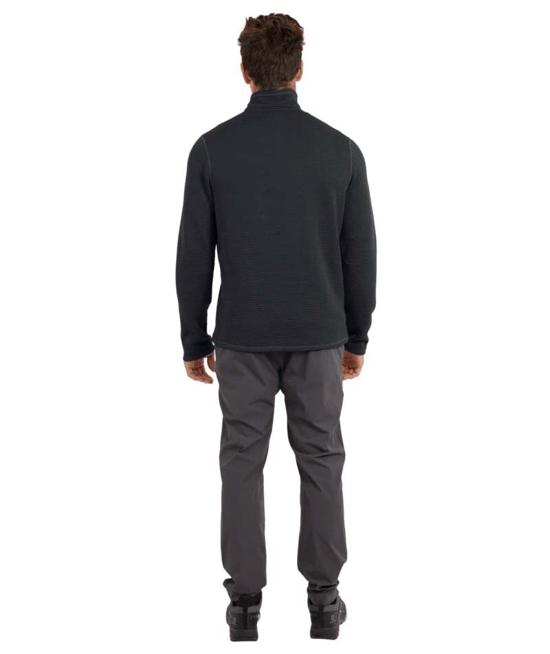 MMerinoAeroGridFleece-A man wearing a dark charcoal gray quarter-zip long-sleeve performance pullover and dark gray pants, standing against a solid white background.