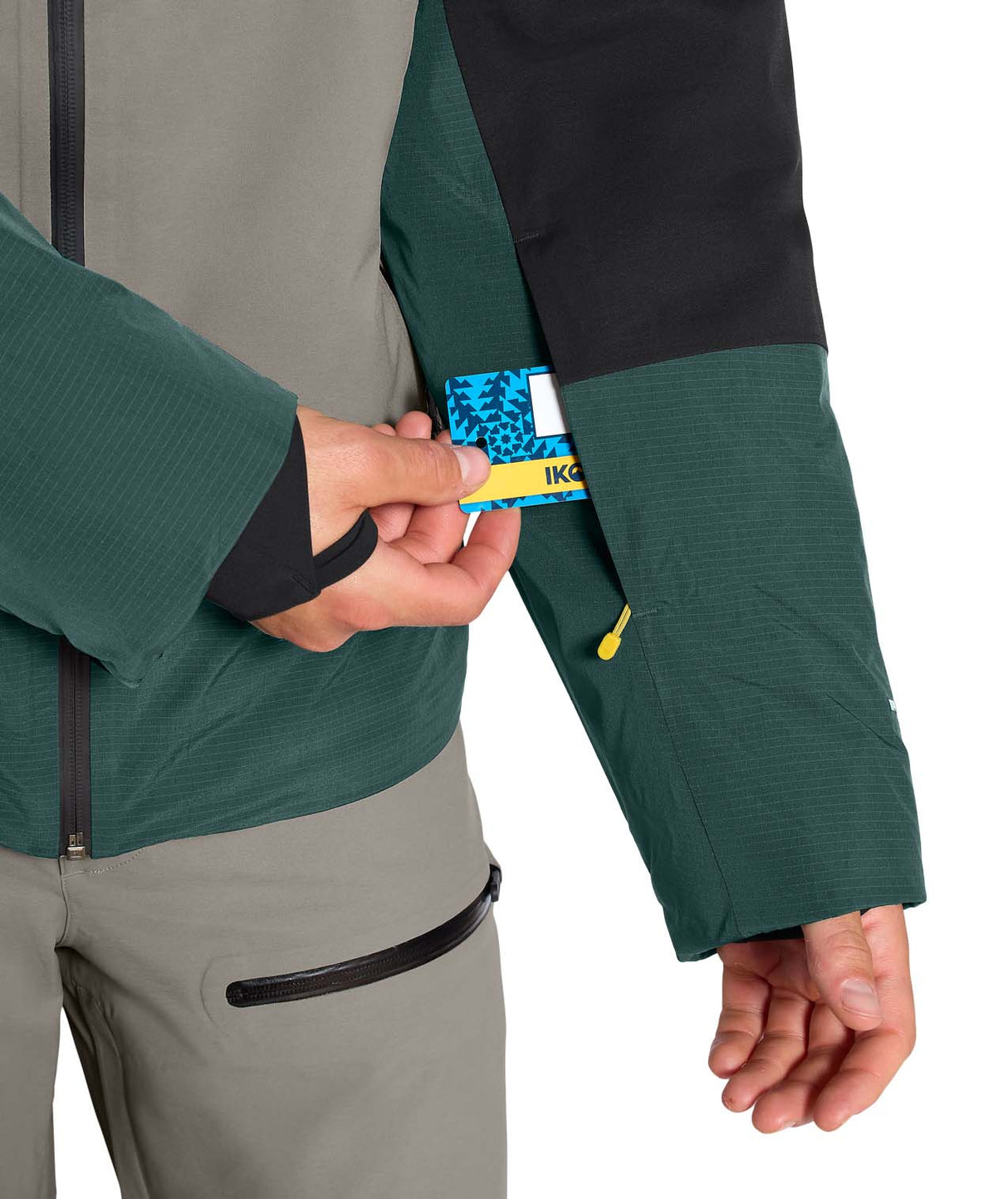MSnowsquallJacket-Green and gray jacket with The North Face logo on a white background