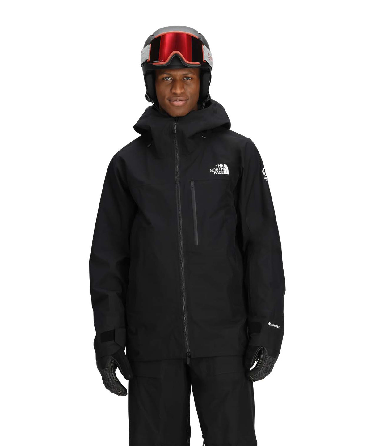 MSummitEastwallGTXJacket-Person wearing a black snow jacket and helmet with goggles on a white background