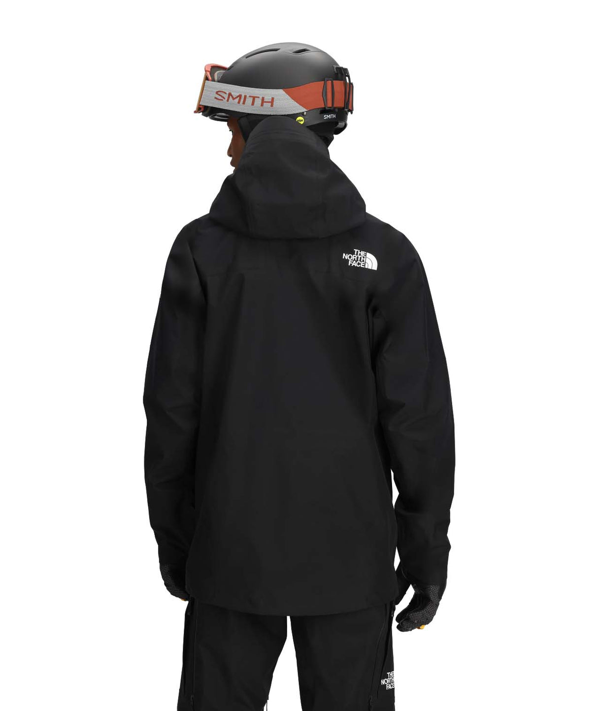 MSummitEastwallGTXJacket-Person wearing a black jacket with The North Face logo, standing against a white background.