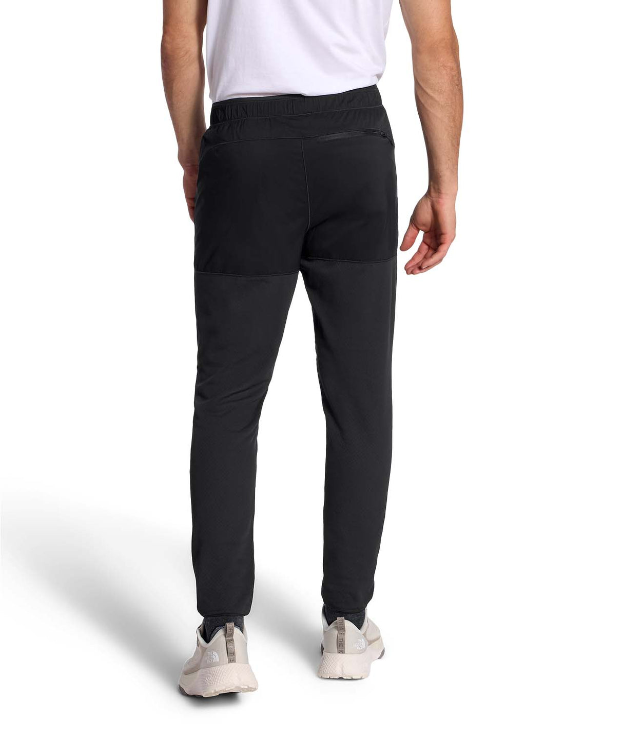 MSummitFUTUREFLEECEPant-Person wearing black jogger pants with a brand logo on a white background