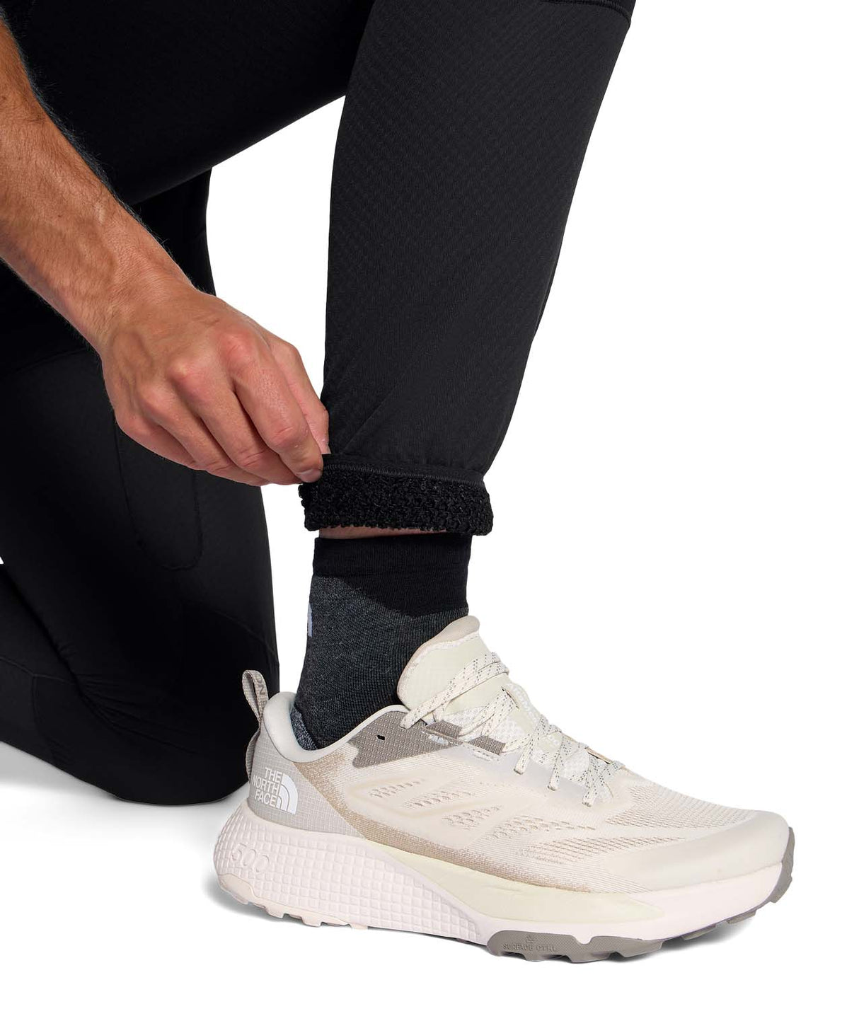 MSummitFUTUREFLEECEPant-Person wearing black jogger pants with a brand logo on a white background