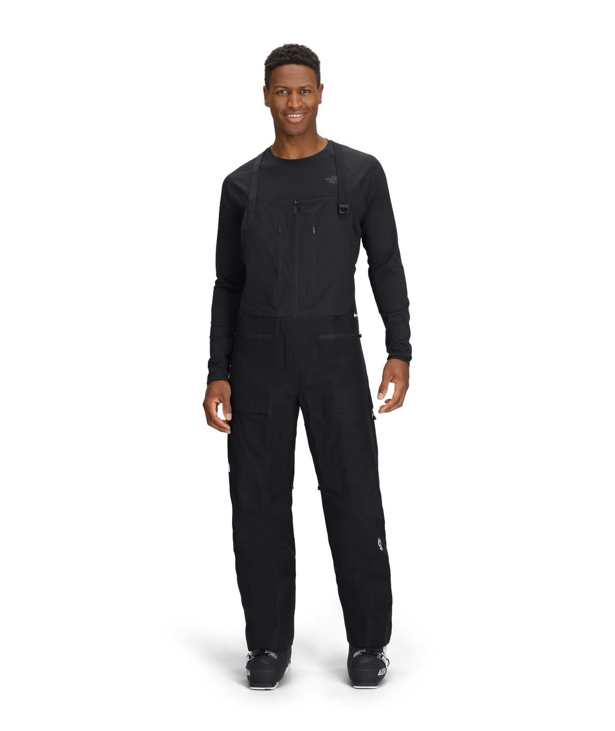 MSummitVerbierGTXBib-Person wearing a black outfit with a brand logo on a white background