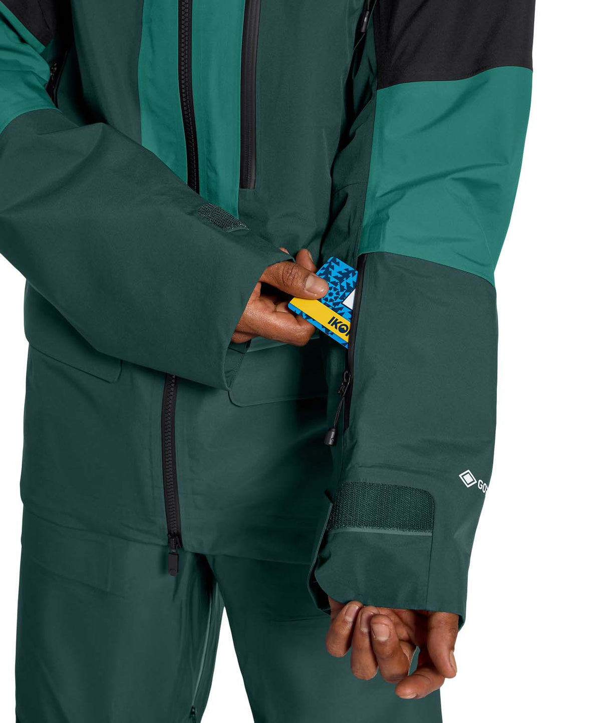 MSummitVerbierGTXJacket- Green and Black hooded jacket with North Face logo on white background