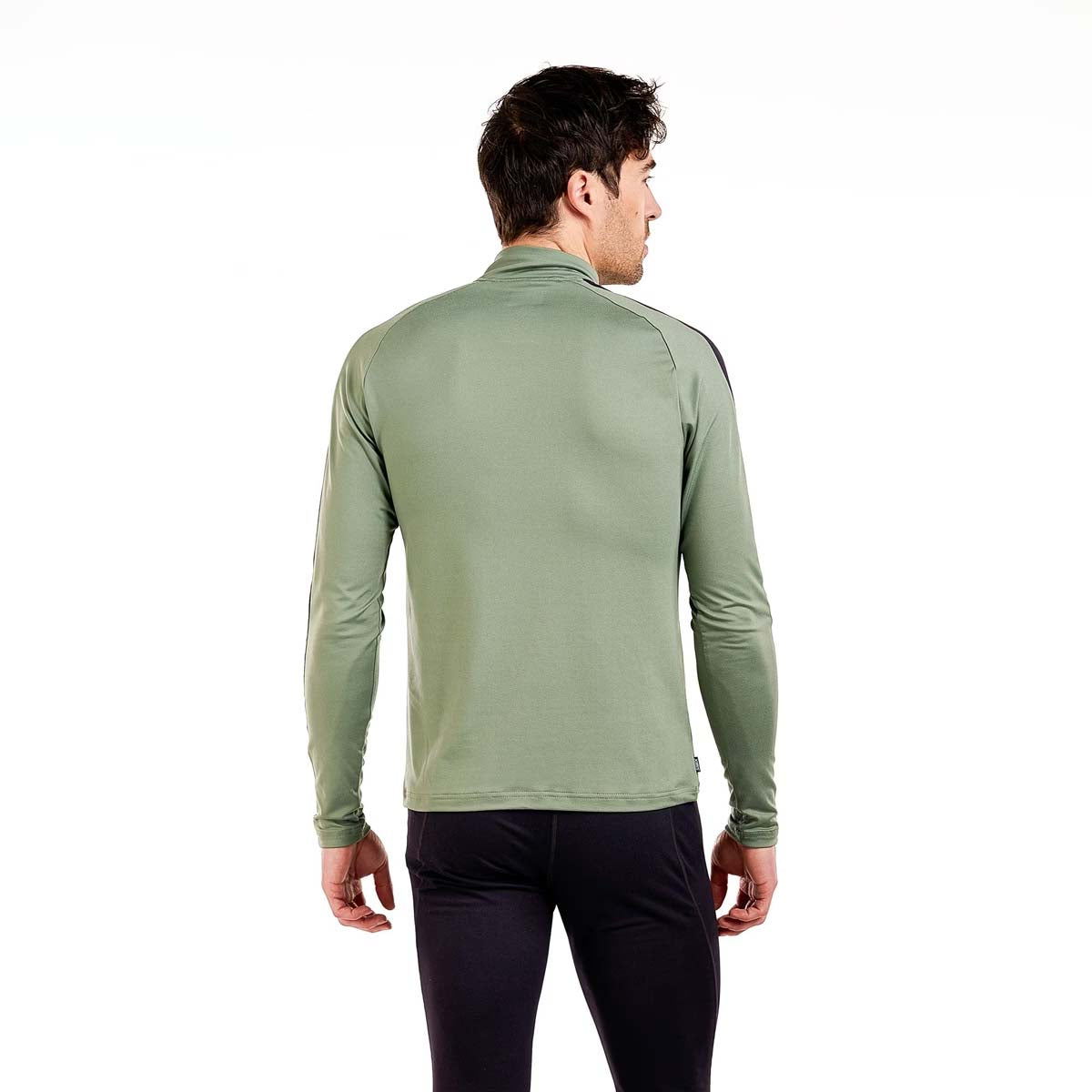 MTista1_2ZipMidlayer- A man wearing a sage green and black long-sleeve quarter-zip athletic pullover, paired with black pants, against a plain white background.