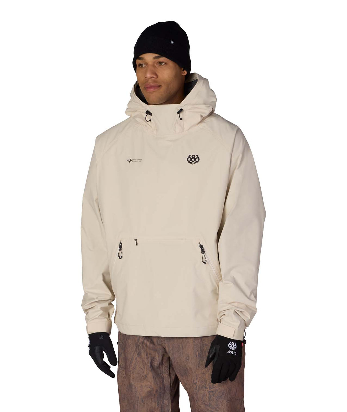 MWindstopperPulloverHoody-Person wearing a beige hooded jacket with a logo on a white background