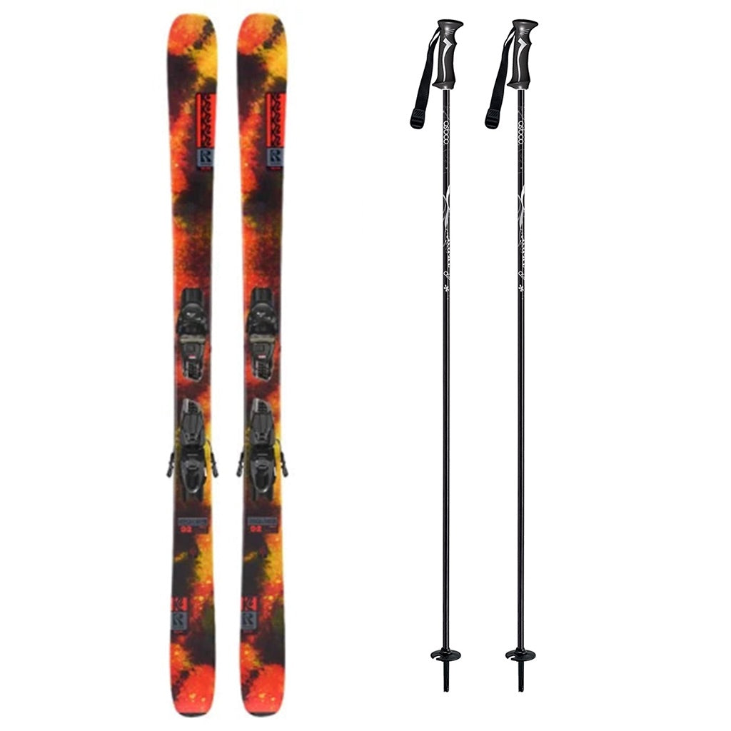 Reckoner92w_Quikclik- A pair of skis with a vibrant orange, red, and yellow flame pattern, shown alongside two black ski poles on a plain white background.