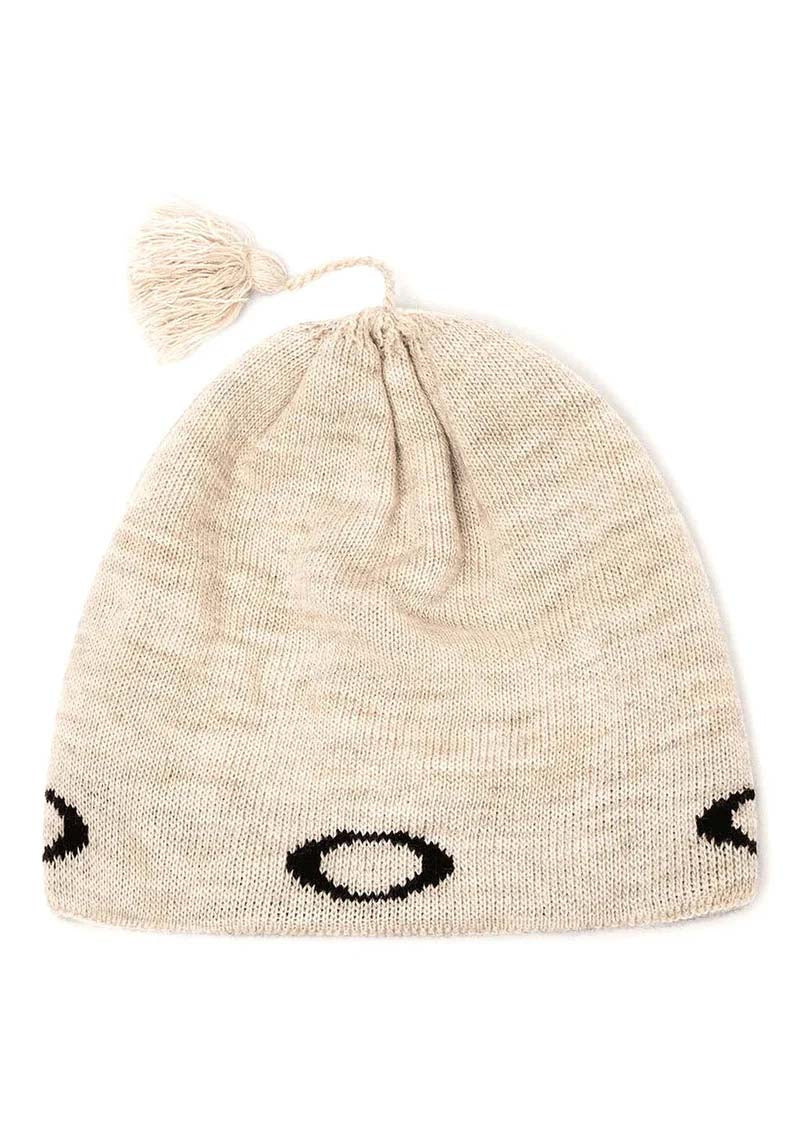 TCNordicTassleBeanie-Beige knit beanie with black logo on a white background