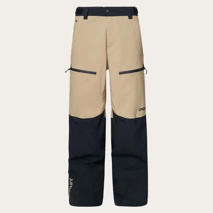 TNPShellPant2.0-Beige and black pants with a brand logo on a light gray background