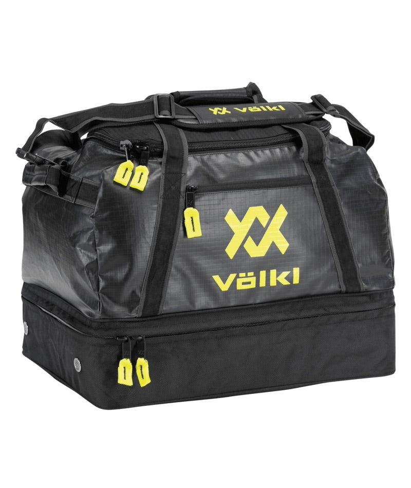 VolklOverUnderWeekendBag- A black Volkl sports duffel bag with bright yellow logo and zipper pull accents, shown on a plain white background.