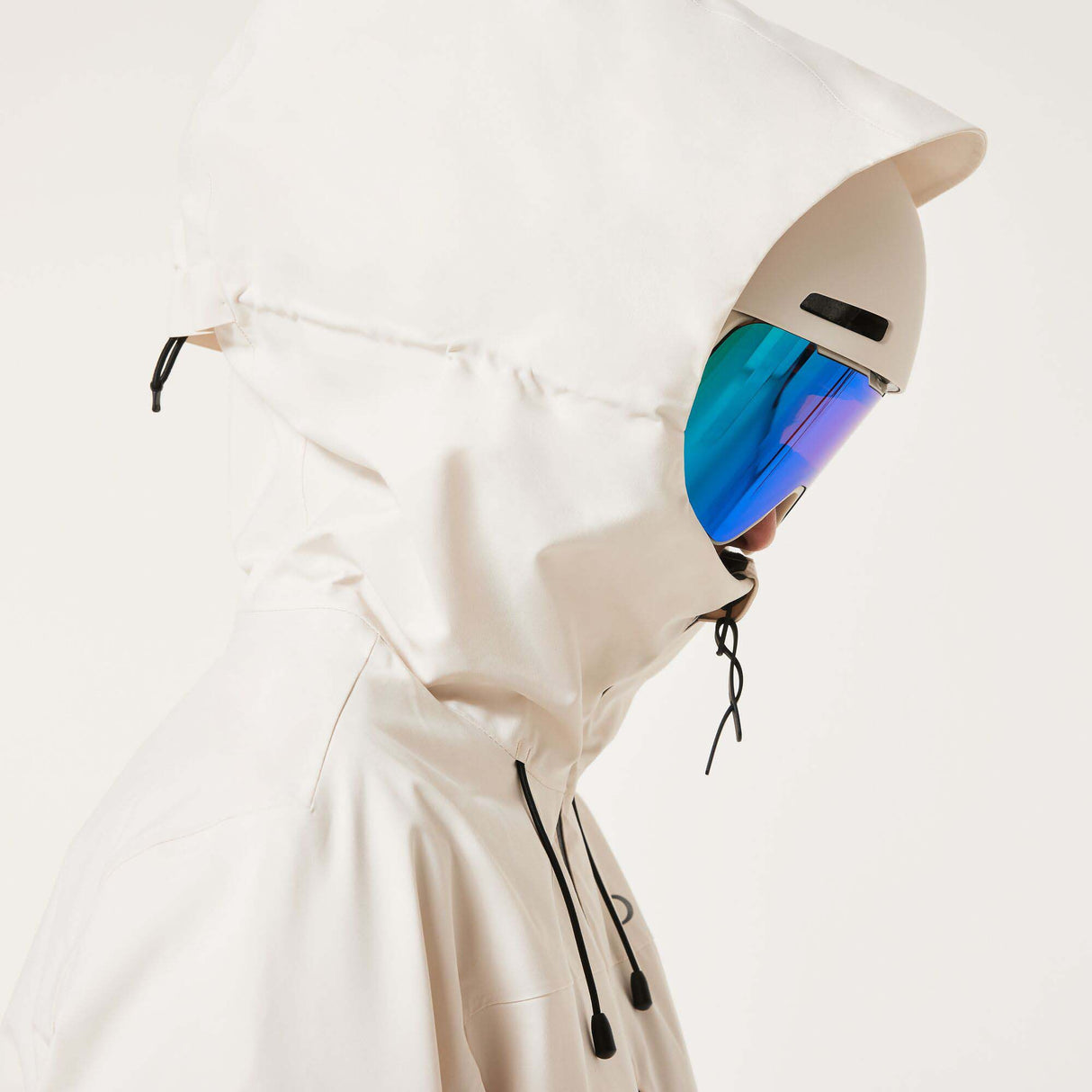 WCanopyInsulatedJacket-An off-white hooded ski jacket with black zipper details and drawstrings, displayed on a neutral light gray background.