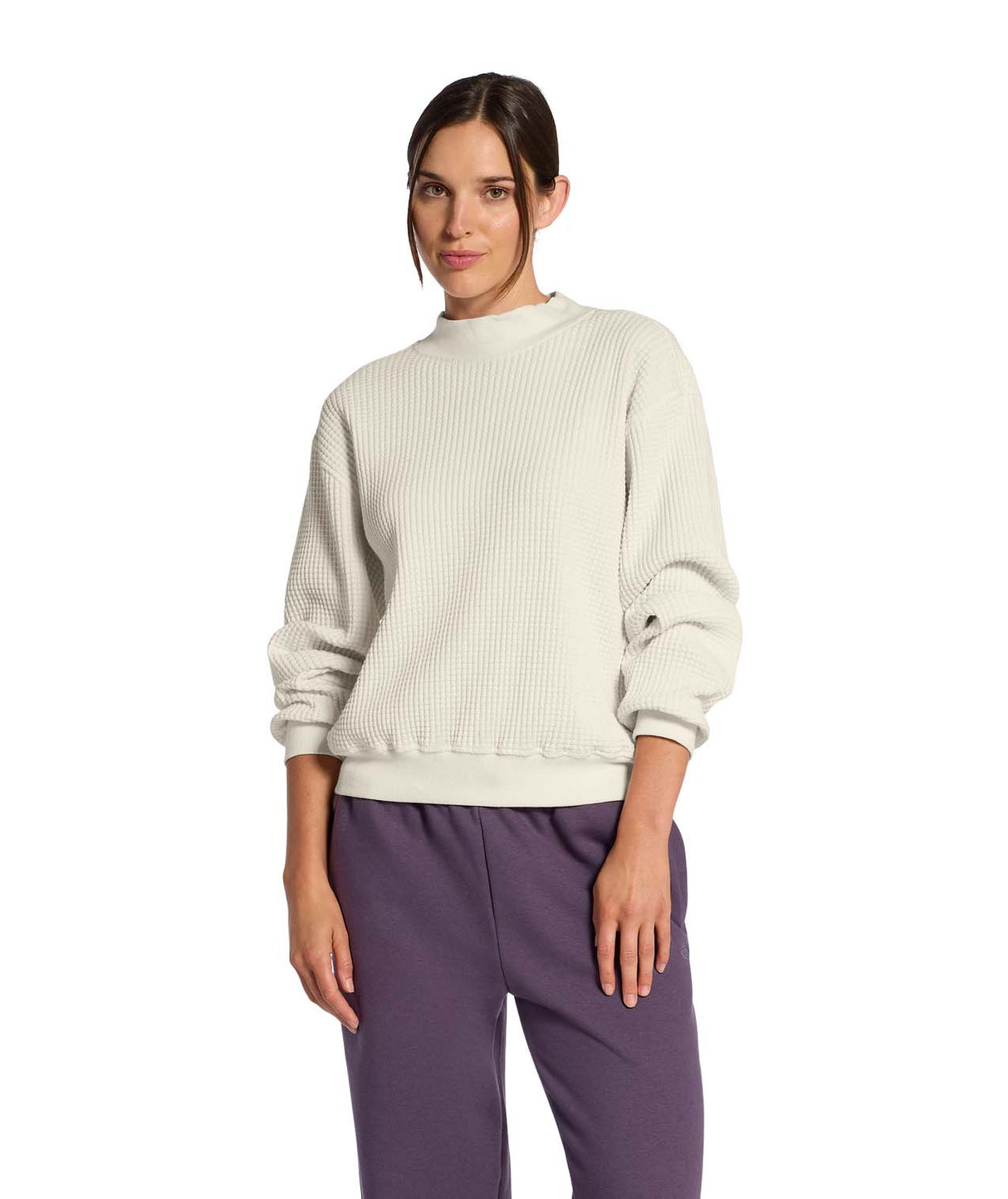 WChabot2.0MockNeck-Woman wearing a beige ribbed mock-neck sweater on a white background