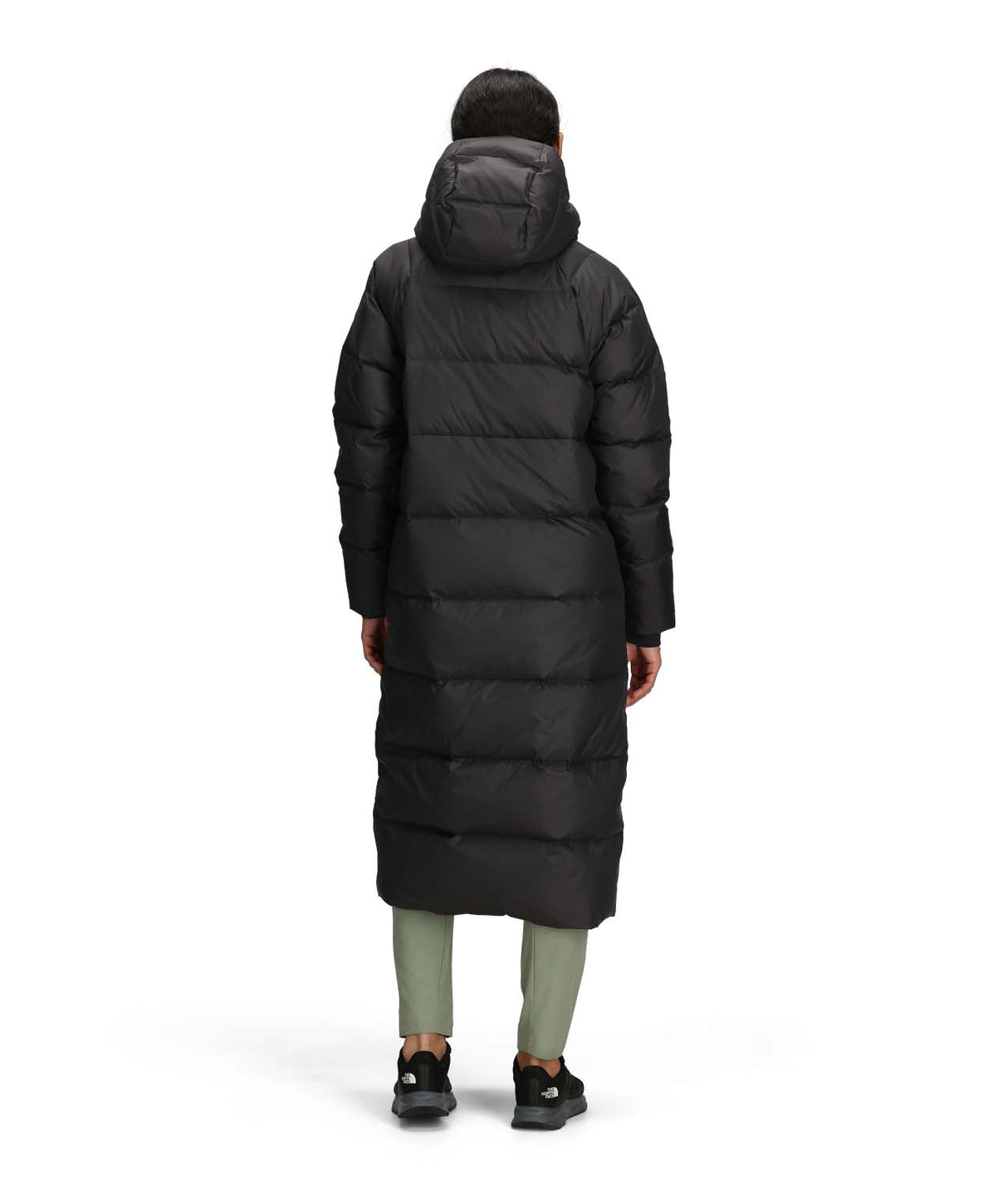 WHydrenaliteCityLongDownHoodedParka-Person wearing a long black puffer coat on a white background