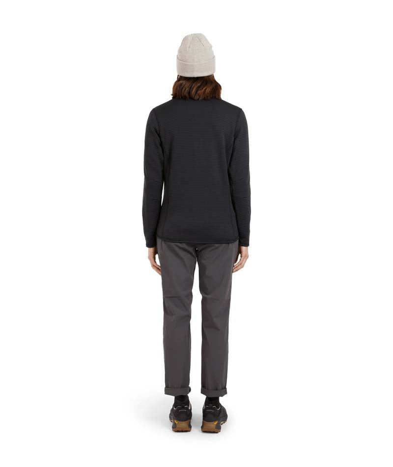 WMerinoAeroGridFleece-A woman wearing a dark charcoal ribbed quarter-zip pullover sweater, gray pants, and a light gray beanie, standing against a solid white background.