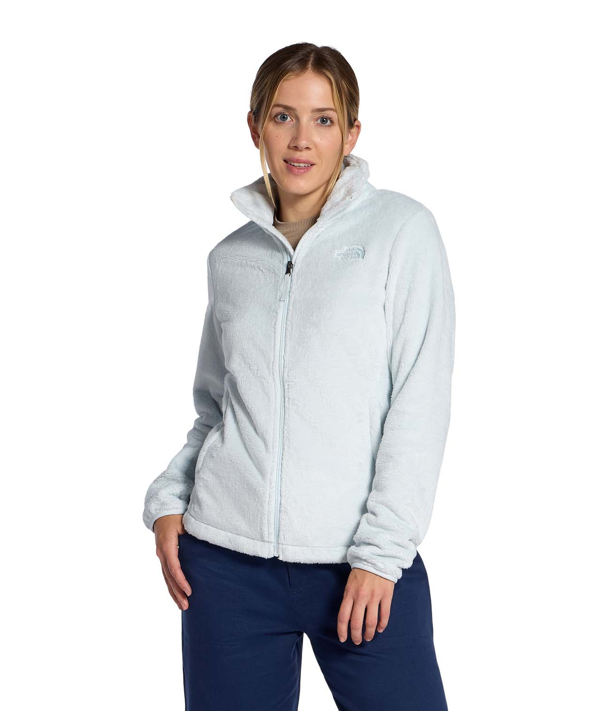 WOsitoJacket- Woman wearing a beige full zip fleece jacket with a brand logo on a white background