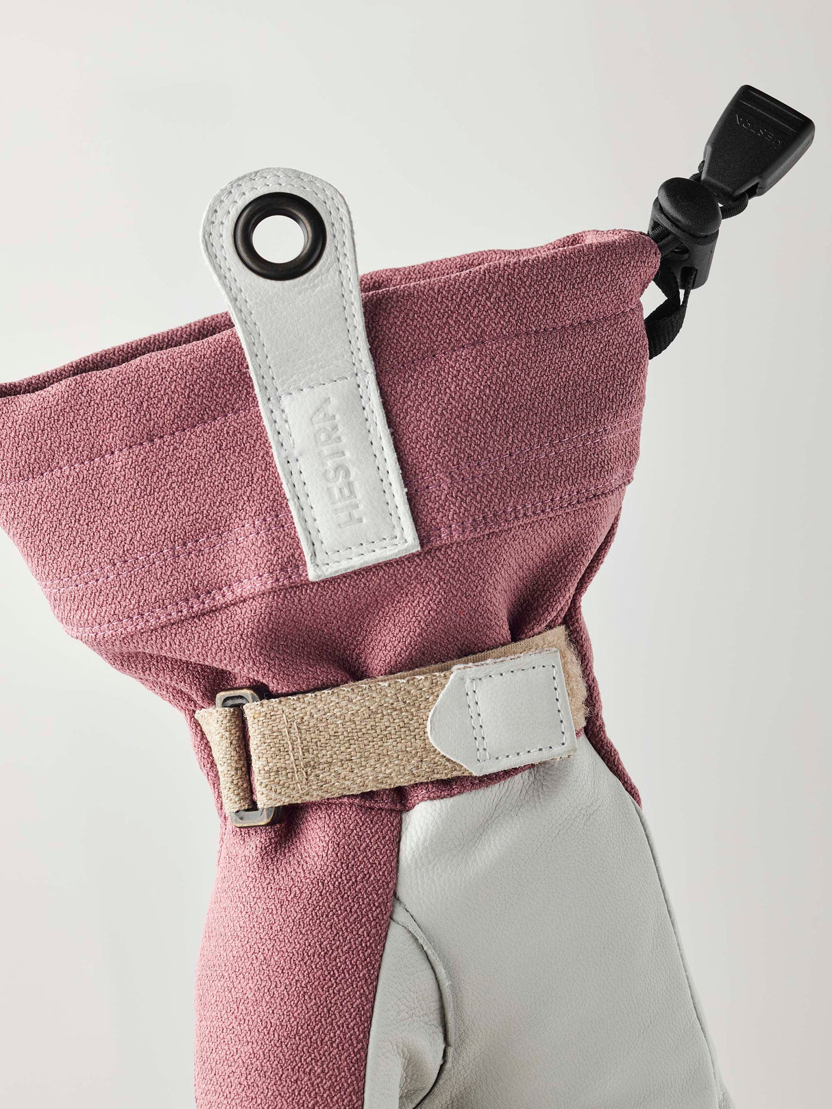 WPatrolGauntletGlove-Pair of pink and white gloves with a visible brand logo on a white background