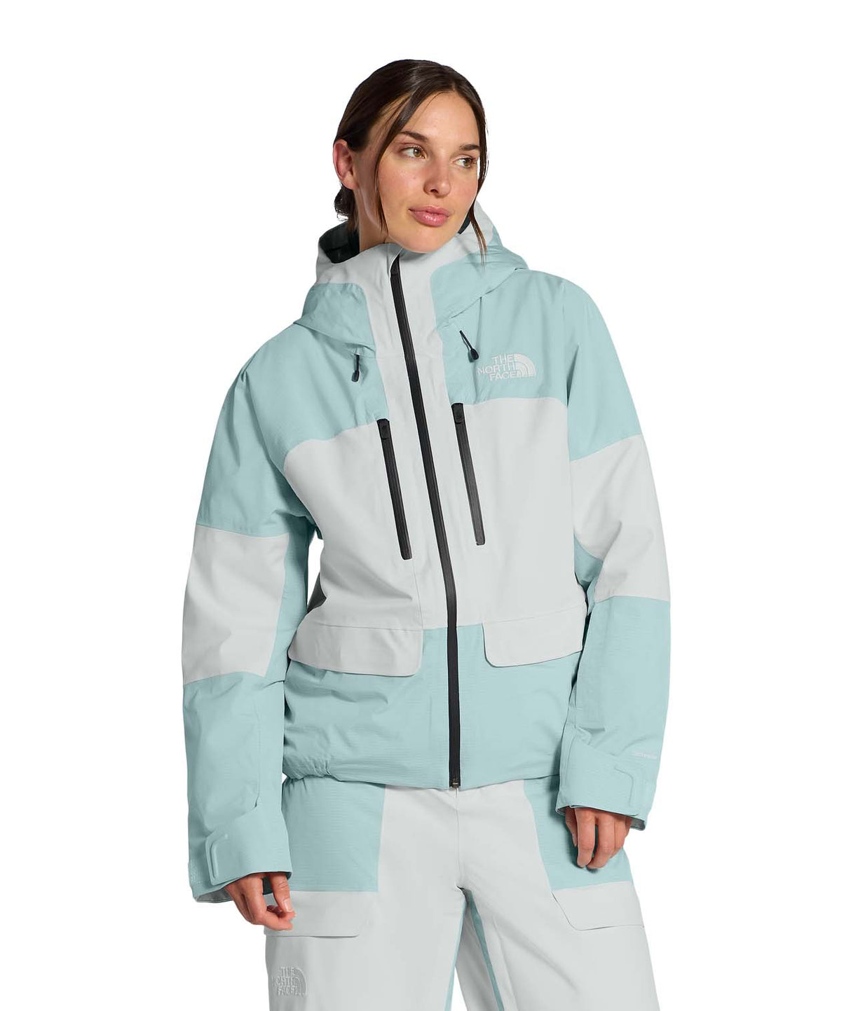 WPowstarJacket-Person wearing a light blue jacket with The North Face logo on a white background
