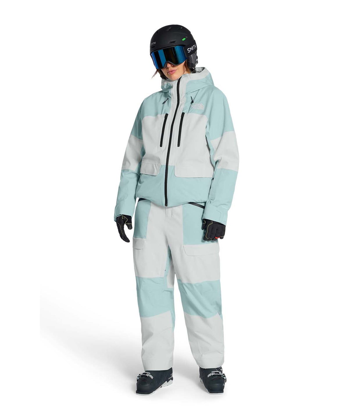 WPowstarJacket-Person wearing a light blue jacket with The North Face logo with matching pants on a white background
