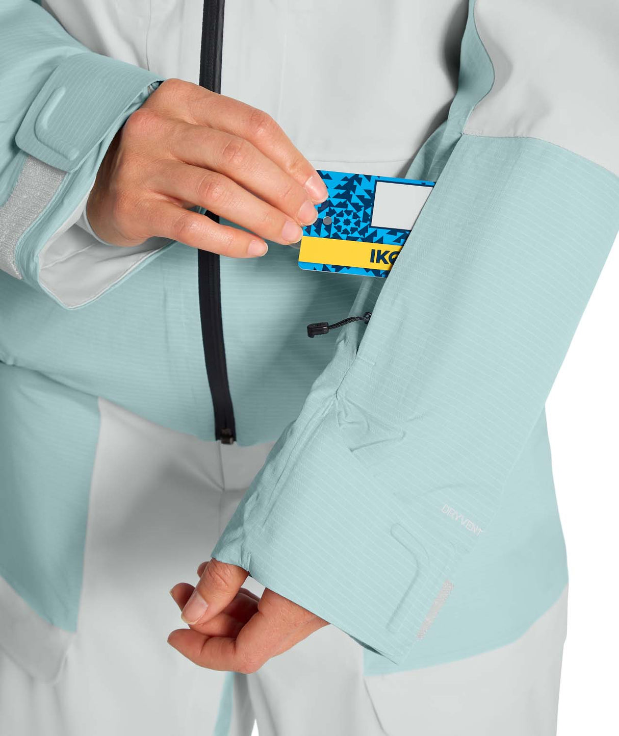 WPowstarJacket-Person wearing a light blue jacket with The North Face logo on a white background