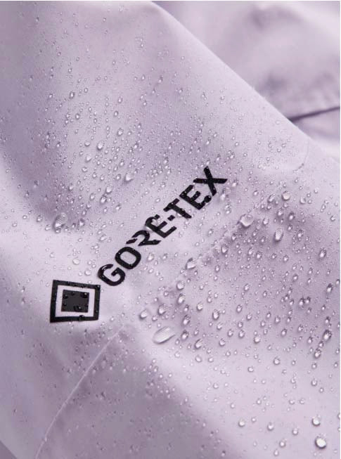 WReserveGORE-TEX2LInsulatedJacket-Light purple jacket with black zippers on a white background