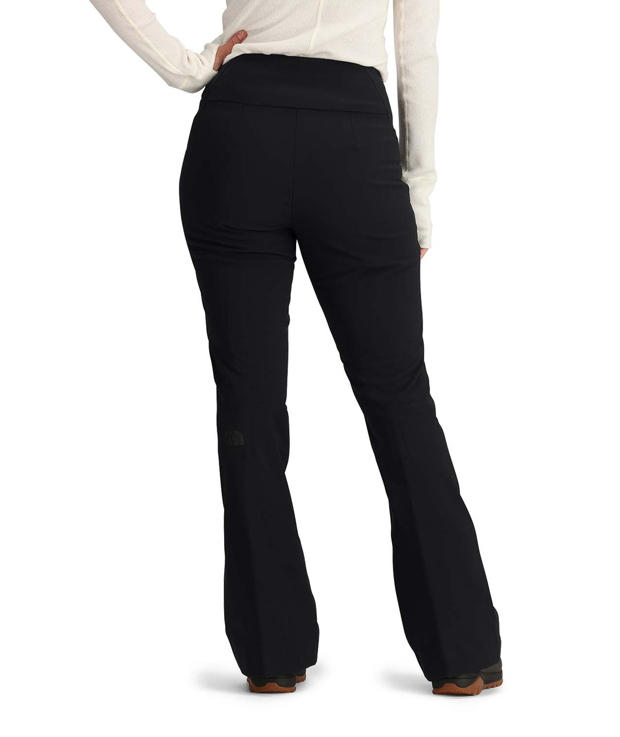 WSnogaPant-Black flared pants worn by a person on a white background